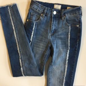 Two toned raw hem skinny jeans